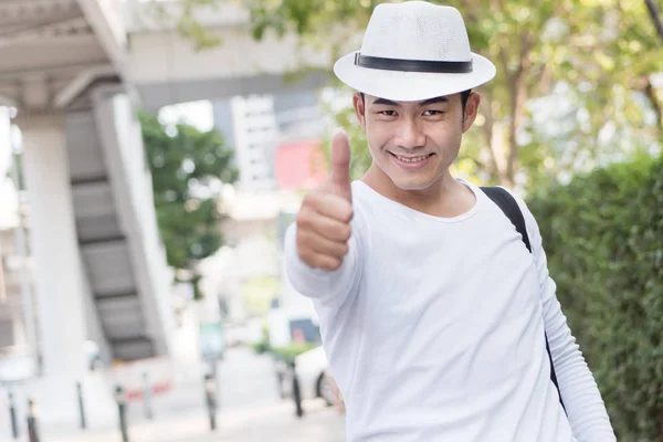 man traveller giving thumb up gesture