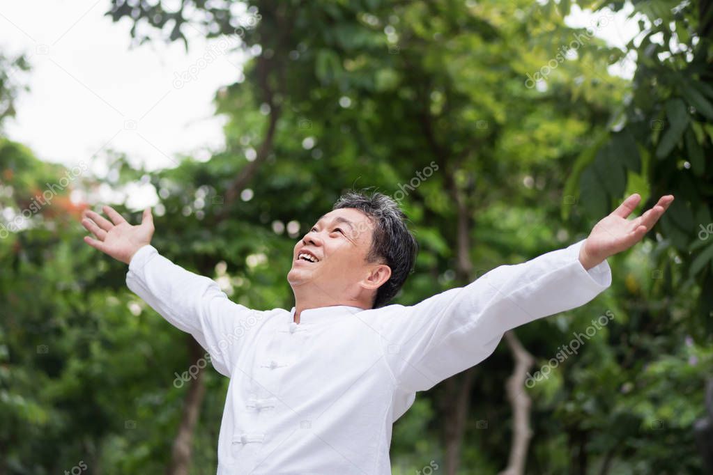 healthy, happy, positive, smiling asian senior man looking up