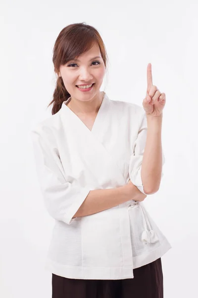 Жінка спа-терапевт вказує на 1 палець, рахуючи, нумерацію — стокове фото