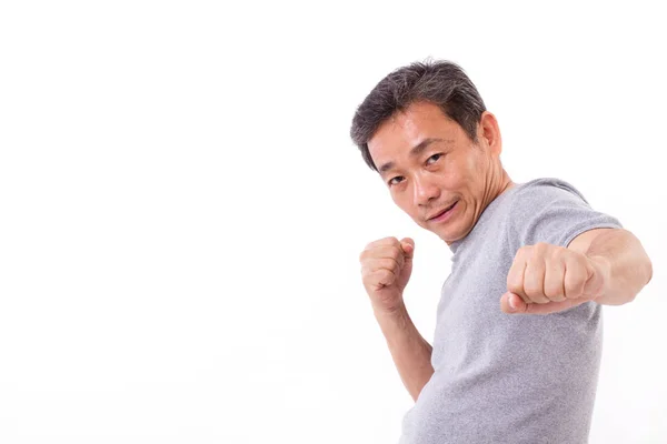 Ativo forte homem de meia-idade perfurando, lutando — Fotografia de Stock