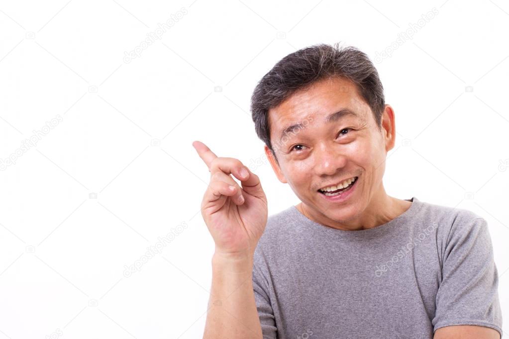 asian middle age man pointing up with an idea