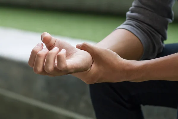 Man suffering from trigger finger, arthritis, wrist pain — Stock Photo, Image