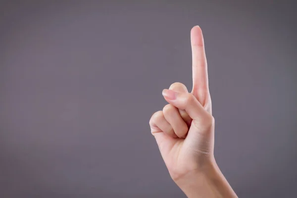 La mano que muestra, apuntando hacia arriba 1 dedos, gesto de la mano número uno — Foto de Stock