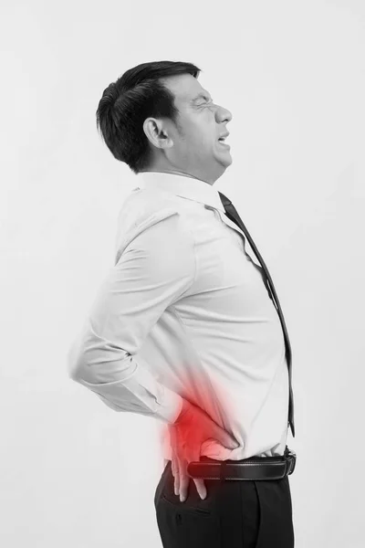 Geschäftsmann leidet an Rückenschmerzen, Wirbelsäulenverletzung — Stockfoto