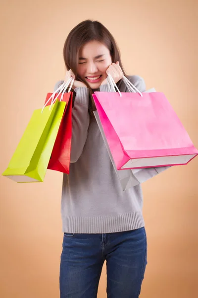 Blij, opgewonden vrouw shopper of klant met boodschappentas — Stockfoto