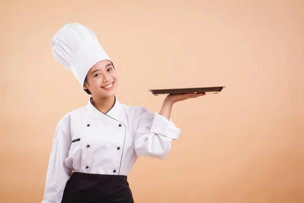 Woman chef hand holding tray, pointing hand to the side way — Stock Photo, Image