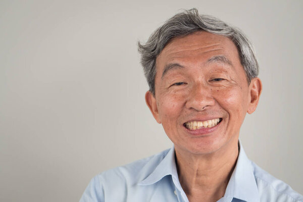 happy smiling positive old senior retired man portrait