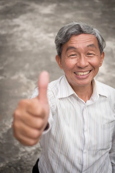 senior man thumb up gesture, accepting approving old man portrait