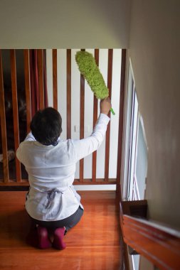 asian middle aged domestic helper woman cleaning apartment, doing housework, housekeeping service clipart