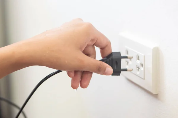 Using Electricity Wall Outlet Wet Hand Electrocute Danger Concept Stock Image