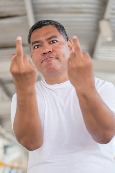angry old man showing rude, vulgar middle finger gesture