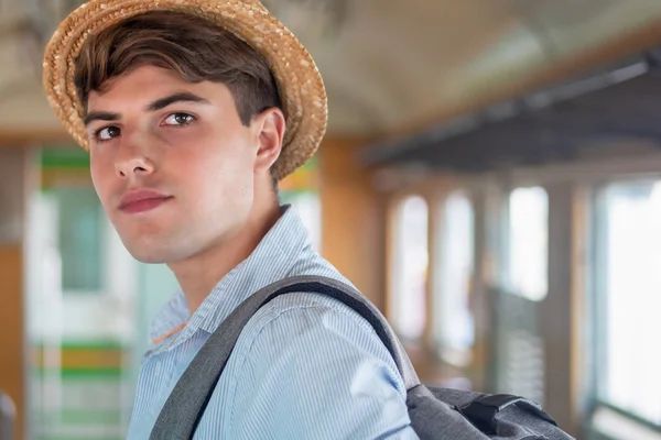 portrait of man backpack traveler with hat; concept of traveling, tourism, vacation trip, backpack travel, solo travel