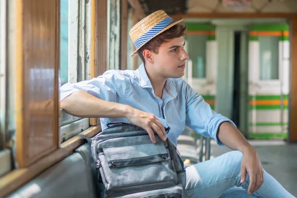 portrait of man backpack traveler with hat; concept of adventure, traveling, tourism, vacation trip, backpack travel, solo travel