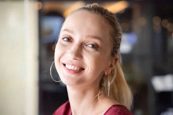 happy woman smiling face, portrait of  caucasian adult model smiles with teeth while looking at you