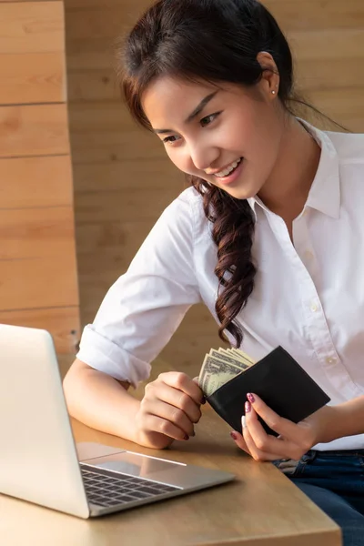 modern woman with online payment money, electronic purse, making money from the internet, app wallet in cashless society