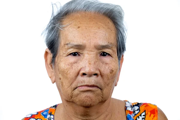 Portrait of an old Asian woman isolated on white  background — Stock Photo, Image