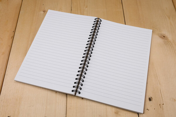 Recycled paper book on wooden background