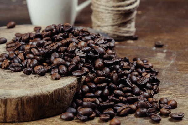 Coffee Bean on wood background with filter effect retro vintage