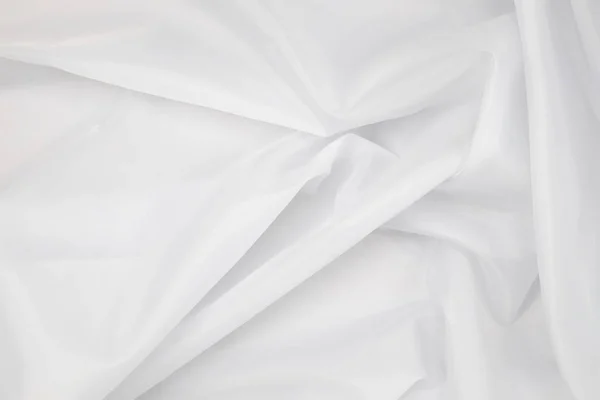 เนื้อผ้าสีขาวพื้นหลัง — ภาพถ่ายสต็อก