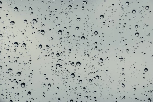 Gotas de lluvia en vidrio de ventana —  Fotos de Stock