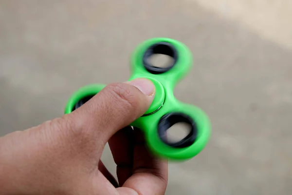 Fidget Spinner speed Spin in hands — Stock Photo, Image