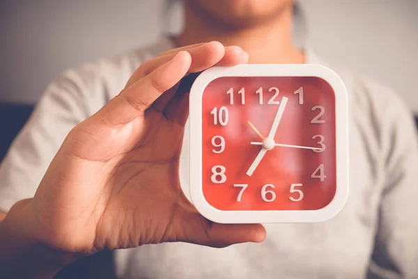 Hand holding Alarm clock with filter effect retro vintage style — Stock Photo, Image