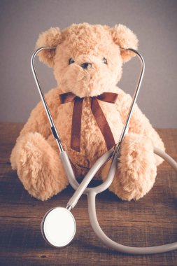 Health Care teddy bear Heart stethoscope with filter effect retro vintage style clipart
