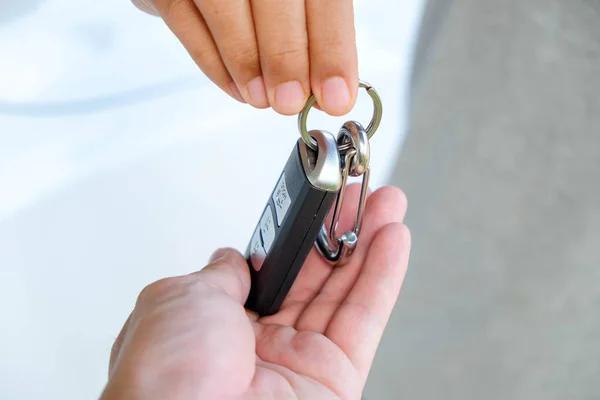 Hand giving car keys — Stock Photo, Image