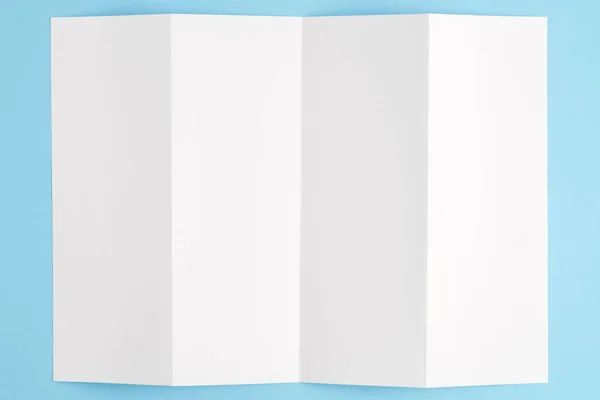 Template fold white paper on blue background — Stock Photo, Image