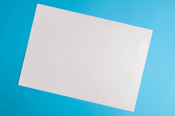 White torn paper with blue background, ready for design — Stock Photo, Image