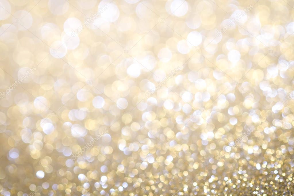 Gold Abstract Christmas twinkled bright background with bokeh de