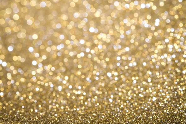 Ouro abstrato Natal cintilou fundo brilhante com bokeh de — Fotografia de Stock