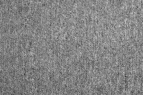 Close up of monochrome grey carpet texture background from above — Stock Photo, Image