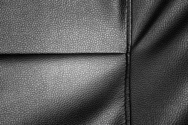 Czarna skóra tekstura tło z sofą — Zdjęcie stockowe