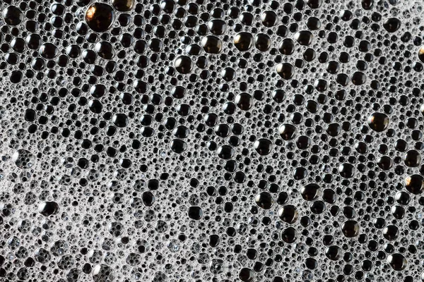 Fundo abstrato textura de espuma de sabão branco. Espuma de champô com — Fotografia de Stock