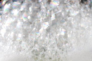 Arka plan beyaz sabunlu köpük doku. Şampuan köpük ile 