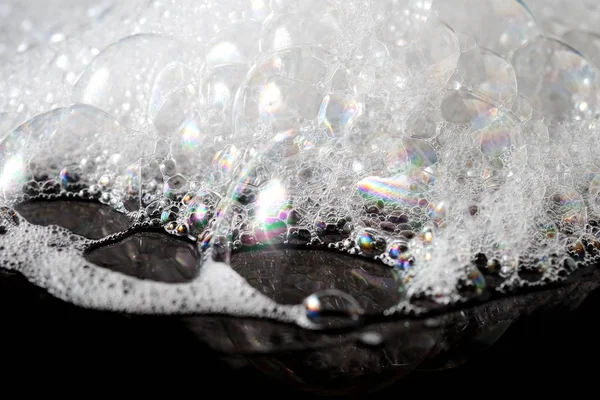 抽象的な背景の白い石鹸の泡のテクスチャです。シャンプーの泡 — ストック写真