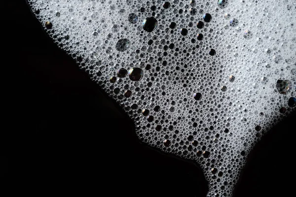 抽象的な背景の白い石鹸の泡のテクスチャです。シャンプーの泡 — ストック写真
