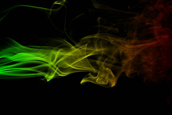 Abstract background smoke curves and wave reggae colors green, yellow, red colored in flag of reggae music