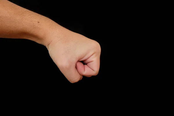 Male clenched fist isolated on black background — Stock Photo, Image