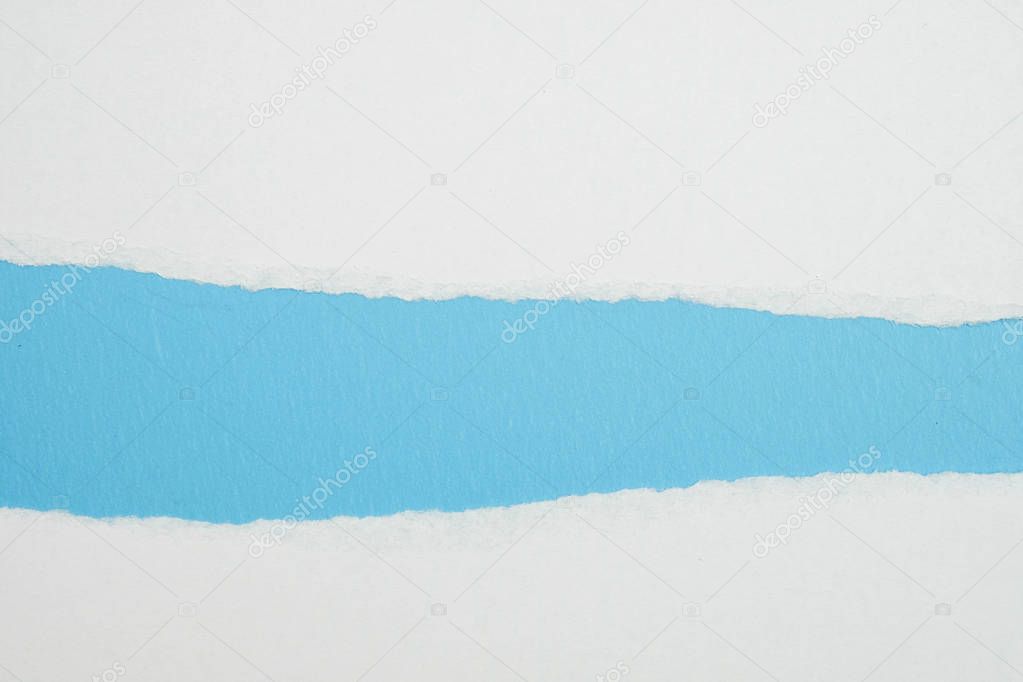 white torn paper with blue background, ready for design