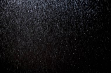 Soyut yağmur dokusu arka planı. arkaplan yağmuru gece ışığında