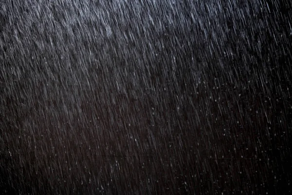 抽象的雨纹理背景。夜光中的背景雨 — 图库照片