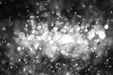 Bokeh 'te noel arkaplanı deseni soyut ışık parıldayan yıldızlar. simli klasik ışık arkaplanı