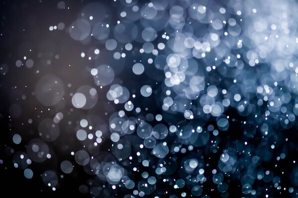 Christmas bokeh background texture abstract light glittering stars on bokeh. glitter vintage lights background