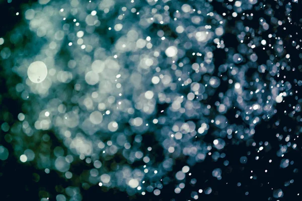 クリスマスボケの背景のテクスチャボケに抽象的な光輝く星 キラキラヴィンテージライト背景 — ストック写真