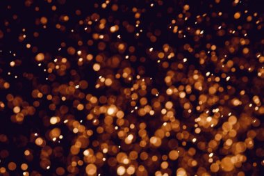 Bokeh 'te noel arkaplanı deseni soyut ışık parıldayan yıldızlar. simli klasik ışık arkaplanı