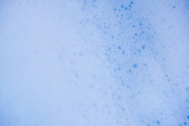 Soyut arka plan beyaz sabunlu köpük dokusu. Köpüklü şampuan köpüğü.