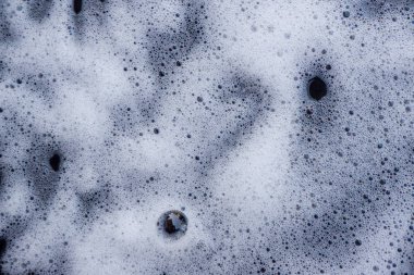 Soyut arka plan beyaz sabunlu köpük dokusu. Köpüklü şampuan köpüğü.