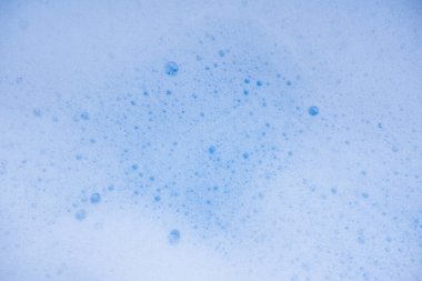 Soyut arka plan beyaz sabunlu köpük dokusu. Köpüklü şampuan köpüğü.